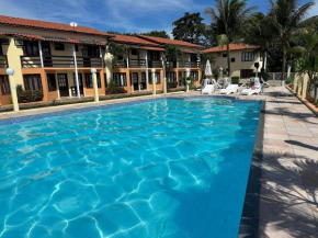 A 200m da praia de Taperapuã Axé Moi casas com 2 suítes (ambas com ar split), condomínio com quiosques com churrasqueiras , piscina, sauna portaria 24hrs e internet privativa 300MBPS